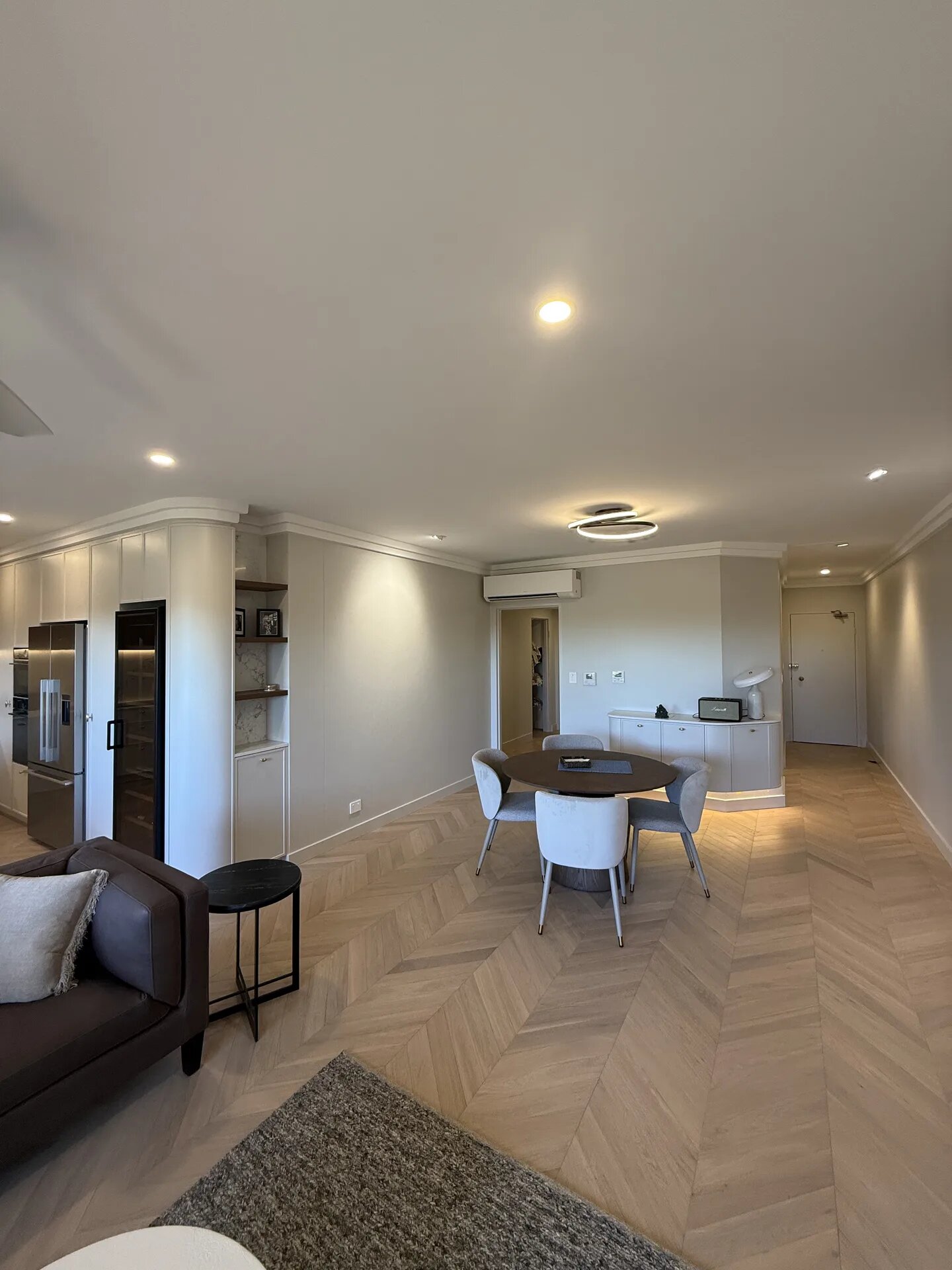 North Sydney apartment renovation with chevron timber flooring by Fine Touch Group